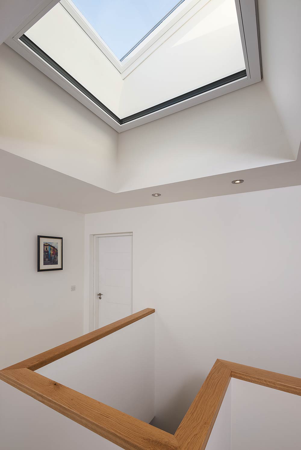 The house features a double-glazed Velux roof window for natural light, with a triple-glazed Munster Joinery Passiv Aluclad window lying horizontal underneath this near the top of the insulation layer