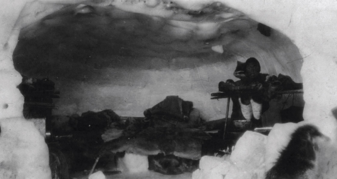 An Inuk inside an igloo, circa 1900 – 1923