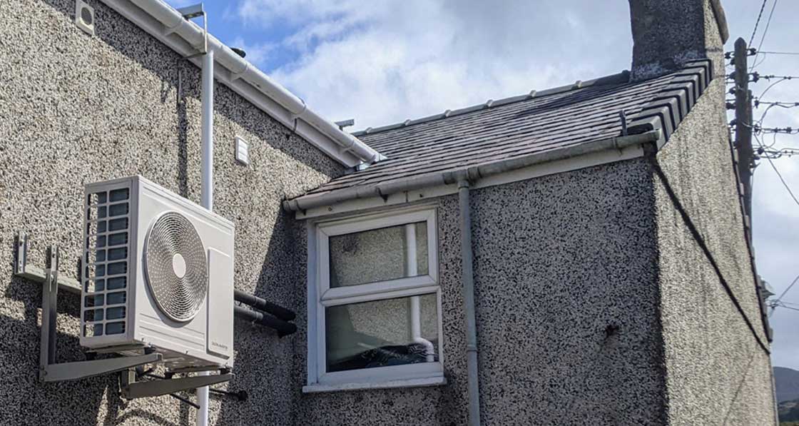 The exterior of Tystean Lea’s house, which he did not insulate; Lea installed some large surface area radiators; and retrofitted a Mitsubishi EcoDan heat pump. The home is listed on heatpumpmonitor.org, with 30 day mean COPs of 4 or over at the time of writing in December.