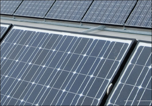 Roof-mounted PV panels overlooking the shopping centre and carpark in Newbridge