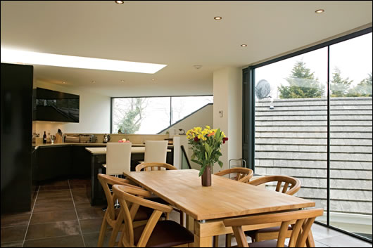 The the first floor contains the kitchen and dining area and was designed to maximise natural lighting and space